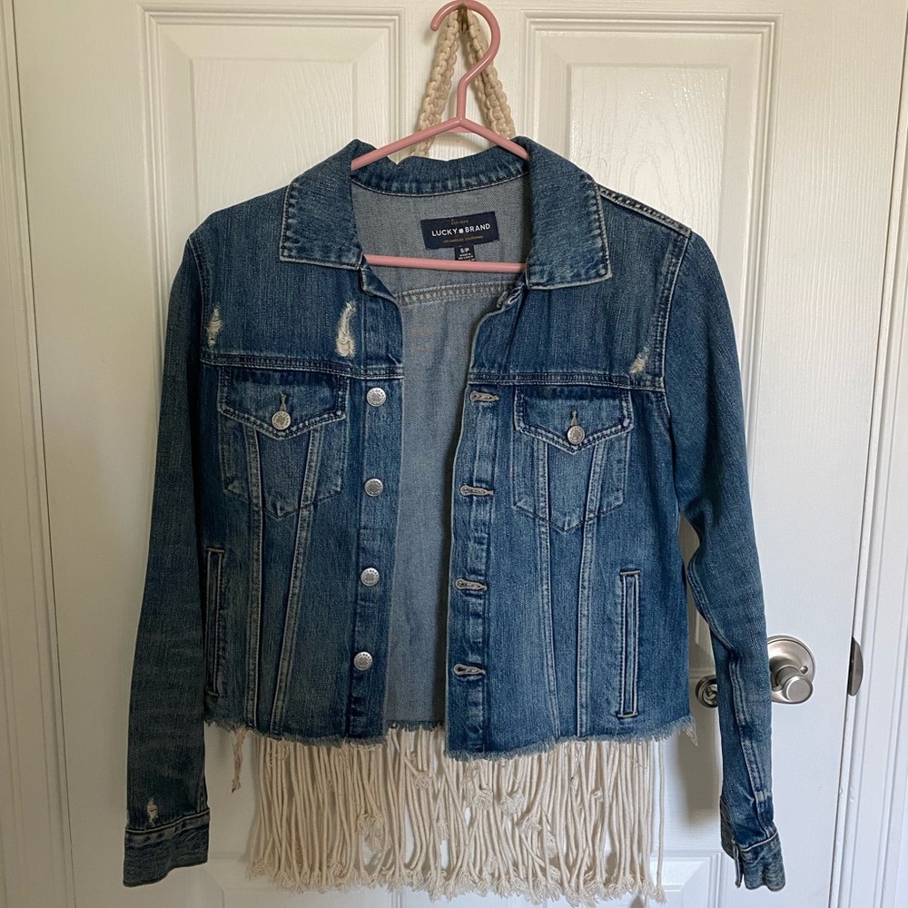 Cropped raw hemmed jean jacket.